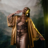 Ihuoma Founder, Annabelle wearing Kauri Corset Belt, with Zanzibar Silk and Embroidery Kimono and Ma'at Bronze Silk Slip shot by Sally Sparrow.