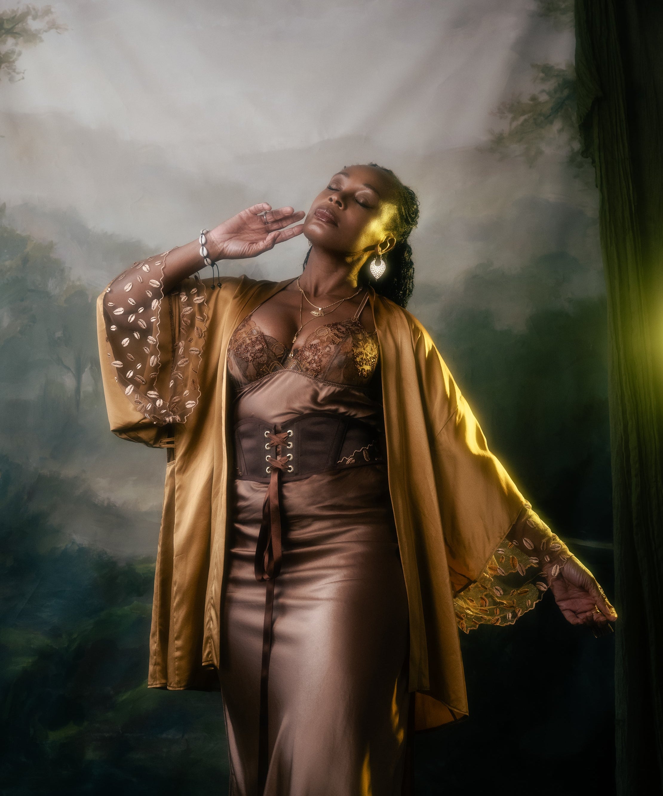 Ihuoma Founder, Annabelle wearing Kauri Corset Belt, with Zanzibar Silk and Embroidery Kimono and Ma'at Bronze Silk Slip shot by Sally Sparrow.