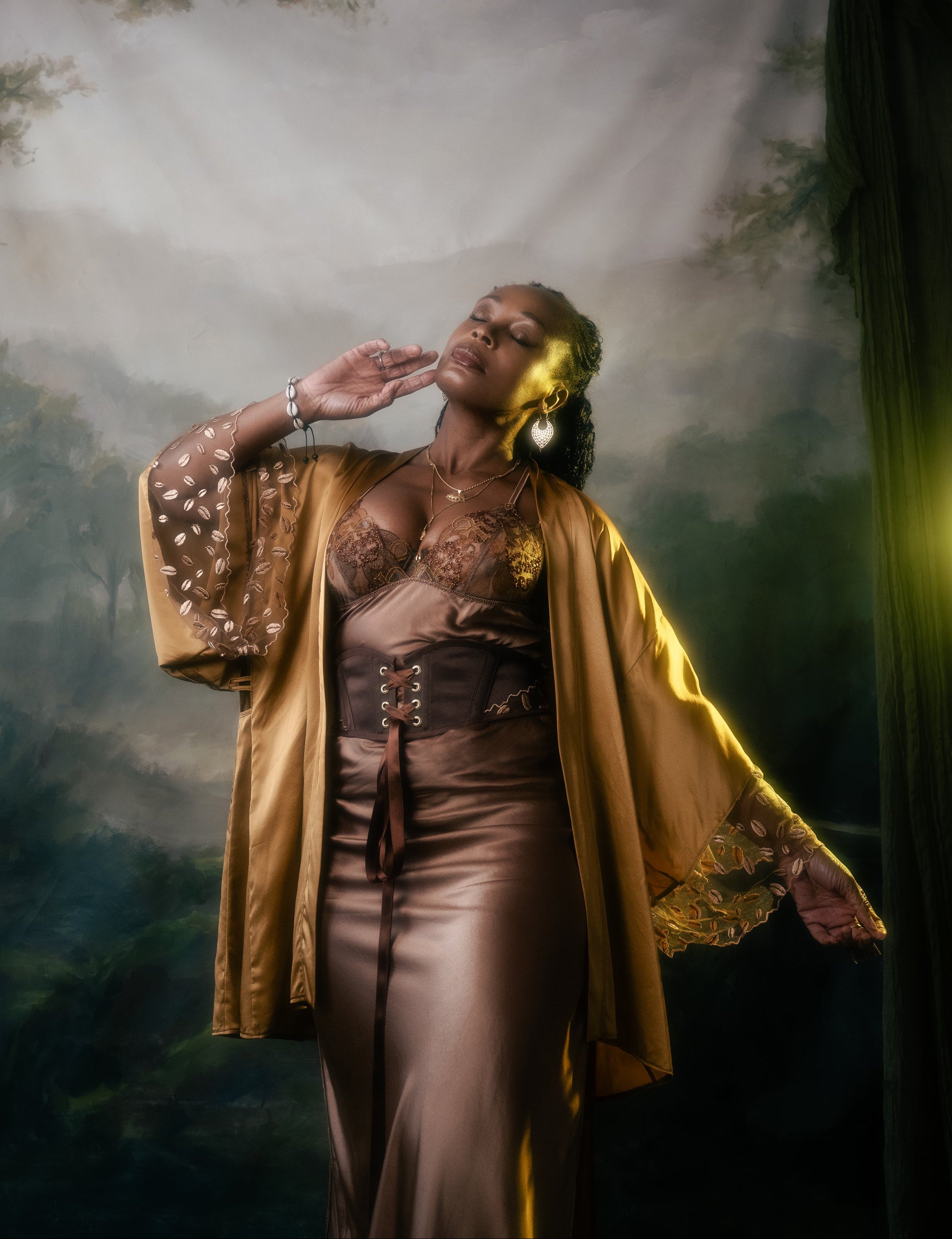 Ihuoma Founder, Annabelle wearing Kauri Corset Belt, with Zanzibar Silk and Embroidery Kimono and Ma'at Bronze Silk Slip shot by Sally Sparrow.