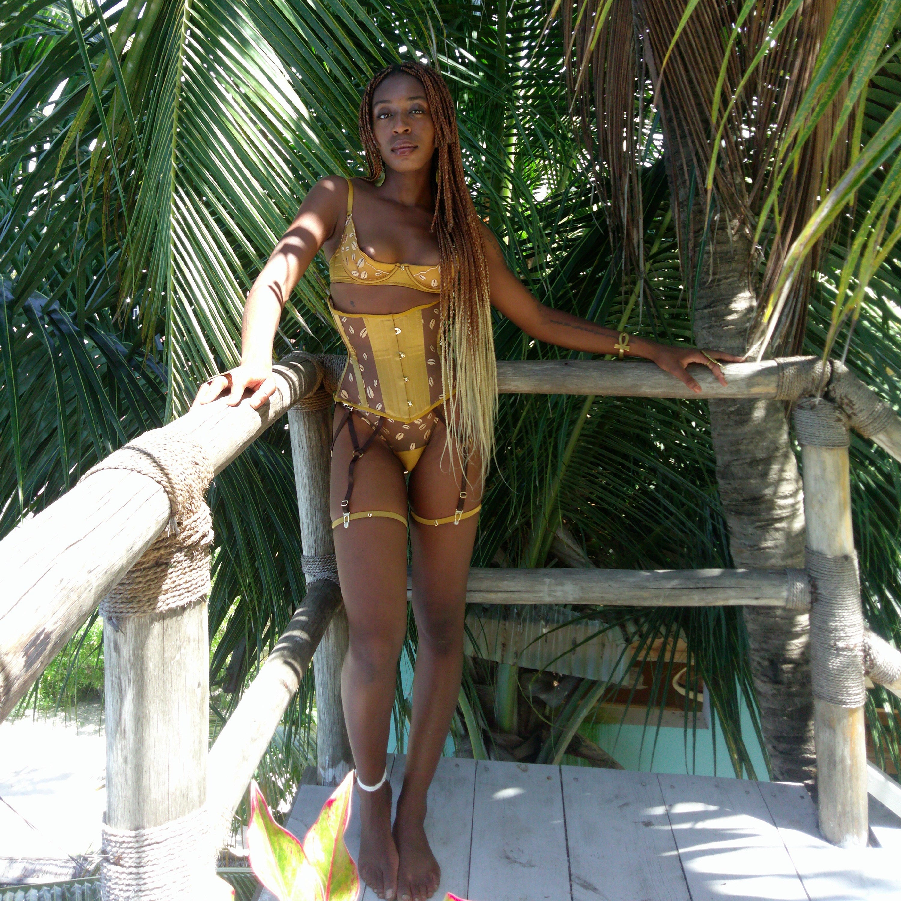 Model wears Ihuoma x Orchid Corsetry Kauri Gold corset paired with Zanzibar Quarter Cup, thong and garter belt - 2
