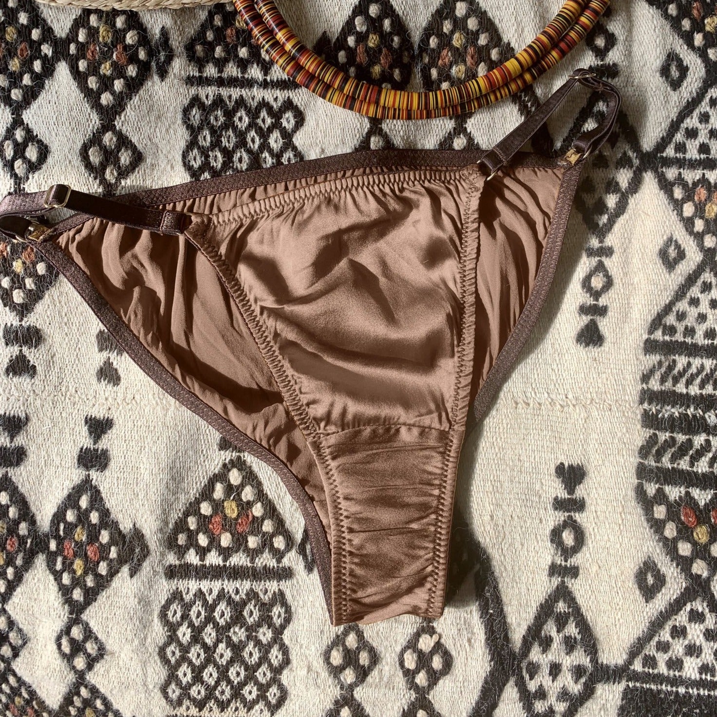Ma'at Bronze Silk Tanga Brief_flatlay_front_Ihuoma