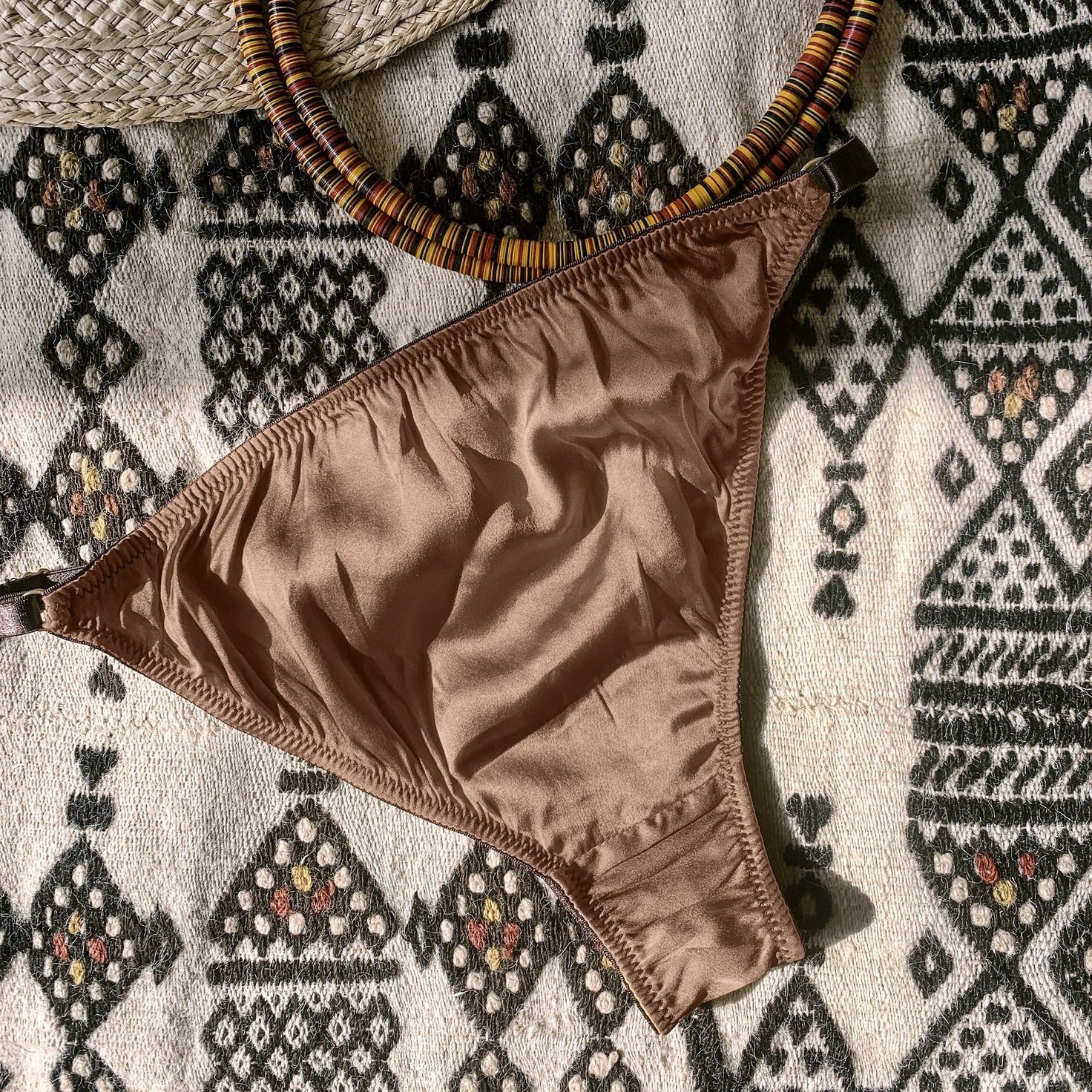 Ma'at Bronze Silk Tanga Brief_flatlay_back_Ihuoma